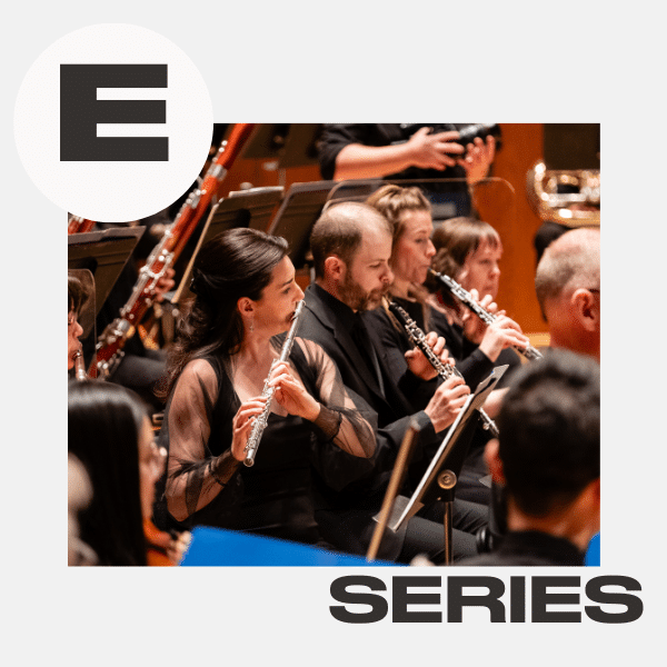 Orchestra musicians playing wind instruments in a concert hall. Large letter E in a white circle at the top left, with the word SERIES in bold at the bottom right.