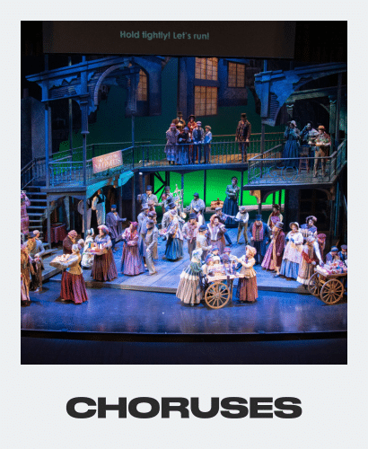 A lively stage scene shows a large group of people in period costumes singing and interacting on a two-level set, with the word “CHORUSES” and the caption “Hold tightly! Let’s run!” displayed above.