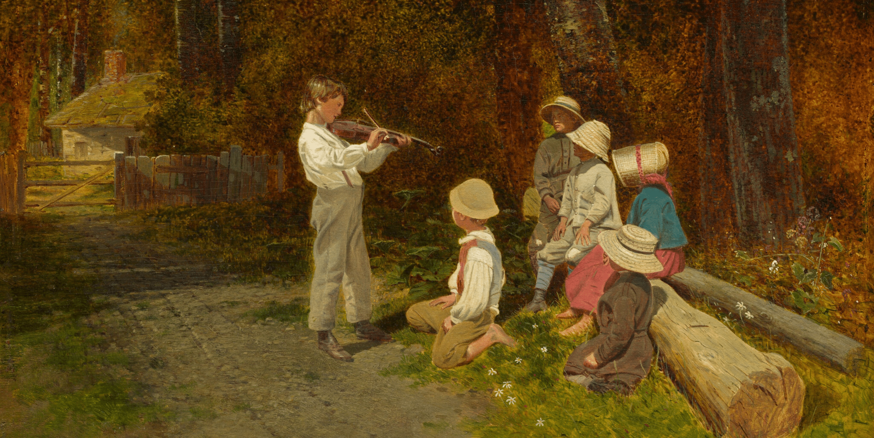 A boy plays the violin for a group of children gathered in a sun-dappled clearing, with a rustic house and fence in the background.